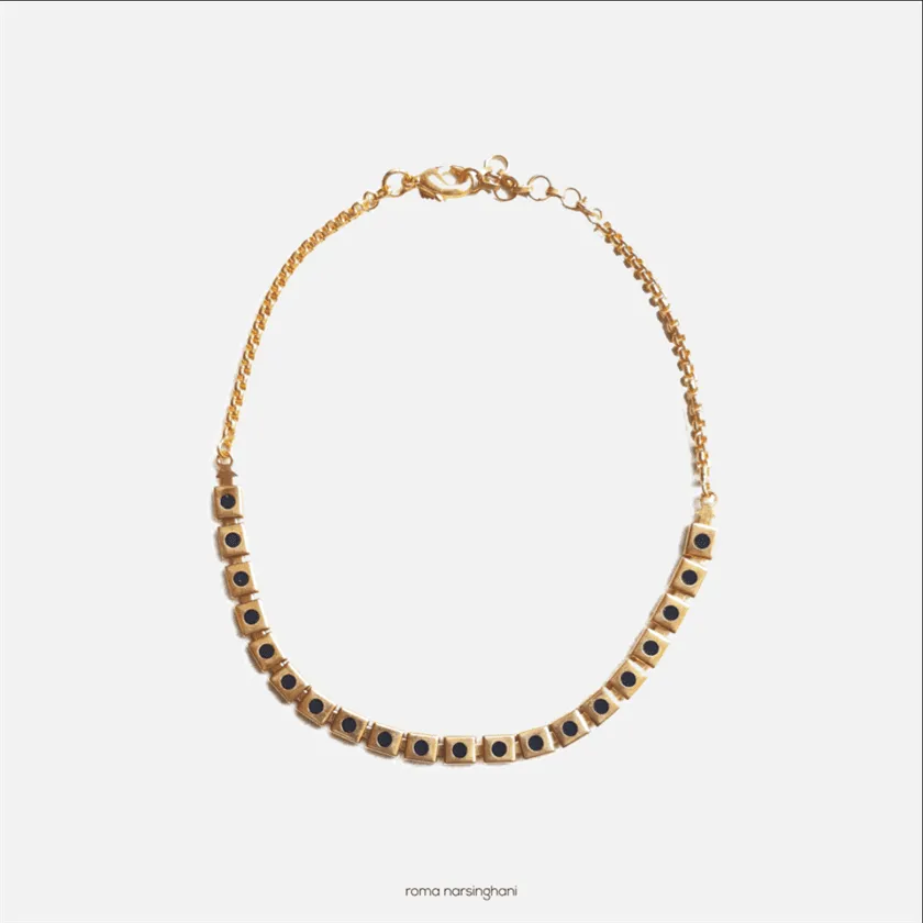 Roma Narsinghani Black Meena Choker Choker The piece is set in brass, hand enameled with 18KT gold finesse. Each piece is unique and handcrafted by our artisans. RNLOVE12