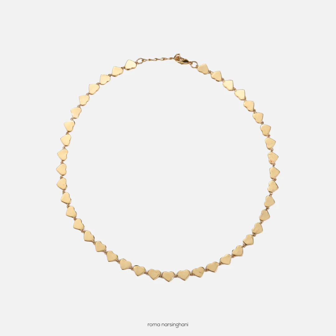 Roma Narsinghani Heart choker Choker The piece is set in brass, with 18KT gold finesse. Each piece is unique and handcrafted by our artisans. RNLOVE16